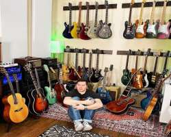 He has a huge guitar collection.